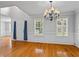 Bright and airy living room features hardwood floors and modern finishes with large windows at 1048 Falls Brooke Dr, Conyers, GA 30094