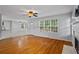 Open living area with a fireplace, hardwood floors, and lots of natural light at 1048 Falls Brooke Dr, Conyers, GA 30094