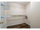 Walk-in closet has vinyl flooring and white shelves to organize your wardrobe at 1048 Falls Brooke Dr, Conyers, GA 30094