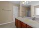 Bathroom showcasing a dual sink vanity with granite countertop at 1137 Misty Valley Ct, Lawrenceville, GA 30045