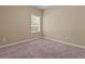 Neutral bedroom with cozy carpet, one window, and base trim at 1137 Misty Valley Ct, Lawrenceville, GA 30045