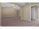 Bedroom featuring carpeted floors, ceiling fan, and arched ceiling at 1137 Misty Valley Ct, Lawrenceville, GA 30045