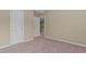 Bedroom featuring plush carpeting, neutral-toned walls, closet, and a doorway at 1137 Misty Valley Ct, Lawrenceville, GA 30045