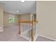 Stairway leading into bonus room with neutral walls and carpet at 1137 Misty Valley Ct, Lawrenceville, GA 30045