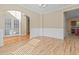 Dining room featuring hardwood floors, wainscotting, and view into other rooms at 1137 Misty Valley Ct, Lawrenceville, GA 30045