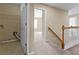 Hallway featuring utility closet, railing, and access to other rooms at 1137 Misty Valley Ct, Lawrenceville, GA 30045