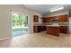 Kitchen with dark wood cabinets, center island, and stainless steel appliances at 1137 Misty Valley Ct, Lawrenceville, GA 30045