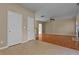 Open living room with hardwood floors and a ceiling fan with lots of natural light at 1137 Misty Valley Ct, Lawrenceville, GA 30045