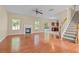 Spacious living room with hardwood floors, fireplace, and large windows, offering a bright and airy atmosphere at 1137 Misty Valley Ct, Lawrenceville, GA 30045