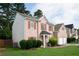 Brick home featuring well-maintained landscaping and a two-car garage, situated in a residential area at 1137 Misty Valley Ct, Lawrenceville, GA 30045