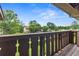 Balcony view of lush green lawns and mature trees surrounding the complex at 124 Camelot Dr, Atlanta, GA 30349