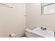Cozy half-bathroom with tile floor and clean, classic fixtures at 124 Camelot Dr, Atlanta, GA 30349