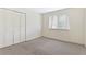 Neutral bedroom with window, carpet and closet space offers a blank slate for your personal design at 124 Camelot Dr, Atlanta, GA 30349