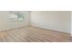 Bright bedroom with laminate flooring and neutral walls is ready for furnishings at 124 Camelot Dr, Atlanta, GA 30349