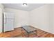 Dining area with wood laminate floors and a modern glass-top table at 124 Camelot Dr, Atlanta, GA 30349