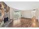 Inviting living room with stone fireplace and access to a private balcony at 124 Camelot Dr, Atlanta, GA 30349