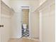Walk-in closet with black and white tile flooring and bathroom visible at 124 Camelot Dr, Atlanta, GA 30349