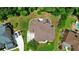 Aerial view of the property shows the backyard, deck, pool, driveway, and surrounding landscape at 2230 Cambridge Hill Ct, Dacula, GA 30019