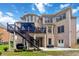 The backyard boasts a multi-tiered deck perfect for outdoor entertaining with access to the home's interior at 2230 Cambridge Hill Ct, Dacula, GA 30019