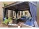 Outdoor entertaining area with a gazebo, seating area, and a fire pit, perfect for relaxing at 2230 Cambridge Hill Ct, Dacula, GA 30019