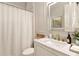 Elegant bathroom features a white marble vanity with gold fixtures and a framed mirror at 2230 Cambridge Hill Ct, Dacula, GA 30019