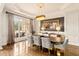 Elegant dining room with tray ceilings and luxurious finishes at 2230 Cambridge Hill Ct, Dacula, GA 30019