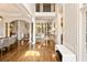 Bright foyer with hardwood floors, grand staircase, and high ceilings, leading into other living spaces at 2230 Cambridge Hill Ct, Dacula, GA 30019