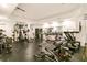 Fully equipped home gym features workout machines, free weights, and mirrored walls at 2230 Cambridge Hill Ct, Dacula, GA 30019