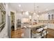 Open kitchen with granite countertops, large island, and modern stainless steel appliances at 2230 Cambridge Hill Ct, Dacula, GA 30019