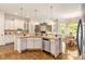 Spacious kitchen featuring white cabinets, granite countertops, and stainless steel appliances at 2230 Cambridge Hill Ct, Dacula, GA 30019