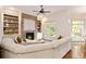 Cozy living room with stone fireplace and built-in shelving at 2230 Cambridge Hill Ct, Dacula, GA 30019