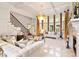 Spacious living room featuring coffered ceilings, fireplace, and tall windows at 2230 Cambridge Hill Ct, Dacula, GA 30019