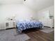 The spacious main bedroom is bright and has a high, vaulted ceiling at 550 Sessingham Ct, Alpharetta, GA 30005