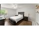 Comfortable bedroom featuring a bed, side tables, and a window with natural light at 603 Brighton Pt, Atlanta, GA 30328