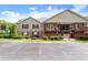 View of the exterior of a multi-Gathering property with parking and lush landscaping at 603 Brighton Pt, Atlanta, GA 30328