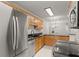 Modern kitchen with stainless steel appliances, granite countertops, and ample cabinet space at 603 Brighton Pt, Atlanta, GA 30328
