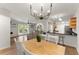 Open-concept living space with hardwood floors, bright lighting, and modern kitchen at 603 Brighton Pt, Atlanta, GA 30328