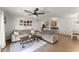 Inviting living space featuring plush sofas, hardwood floors, and direct access to kitchen at 603 Brighton Pt, Atlanta, GA 30328