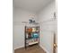 View of walk-in pantry with wire shelving, hardwood floors, and ample storage space at 603 Brighton Pt, Atlanta, GA 30328