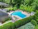 Aerial view showcasing a community pool area with lounge chairs and manicured greenery, a perfect spot for relaxation at 603 Brighton Pt, Atlanta, GA 30328