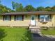 Charming single-story home with a welcoming front entrance and cheerful yellow siding at 649 Mary Ln, Marietta, GA 30062