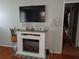 Cozy living room featuring an electric fireplace and mantle for display at 649 Mary Ln, Marietta, GA 30062