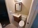 Bathroom features a vanity with a mirror and sink, alongside a toilet, presenting a functional space at 718 Hardy Way, Hiram, GA 30141