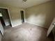 Bedroom with closet, featuring carpeting and neutral walls, ready for personal touches and decor at 718 Hardy Way, Hiram, GA 30141