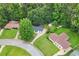 An aerial view of the home nestled within a lush, green neighborhood with mature trees at 1694 Pheasant Dr, Atlanta, GA 30238