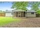 The backyard includes a screened in porch and a grassy area at 1694 Pheasant Dr, Atlanta, GA 30238