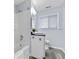 Well-lit bathroom with a shower-tub combo, modern vanity, and wood-look tile flooring at 1694 Pheasant Dr, Atlanta, GA 30238