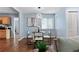 Dining area featuring modern lighting, an elegant decor, and hardwood floors at 1694 Pheasant Dr, Atlanta, GA 30238