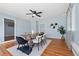 Dining room featuring modern decor, hardwood floors, and a large dining table at 1694 Pheasant Dr, Atlanta, GA 30238