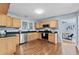 Bright kitchen featuring hardwood floors, stainless steel appliances, and wooden cabinets at 1694 Pheasant Dr, Atlanta, GA 30238